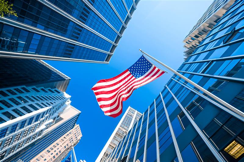 American Flag And High Rise Buildings